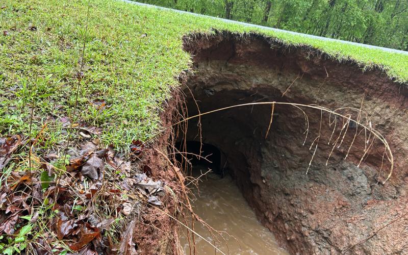 This is the 100 block of East River Bend Drive. The road may look passable, but the culvert pipe underneath has given way, so it cannot withstand the weight of a vehicle. CONTRIBUTED