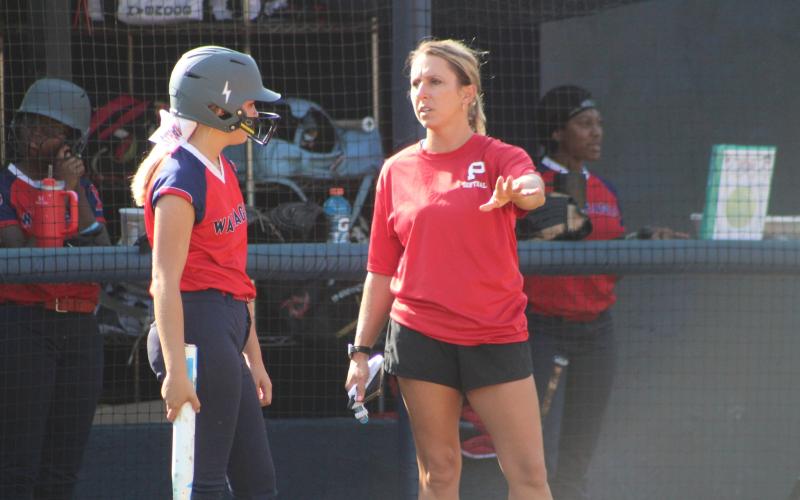 Putnam County head softball coach Mollie Jones talks with one of her players during a scrimmage over the summer. KIM CASH/Contributed