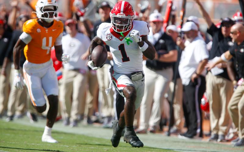 Georgia wide receiver Zacariah Branch (1) rumbles down the sideline on his way to the end zone for a touchdown in the second quarter against the Vols. LANCE McCURLEY/Staff