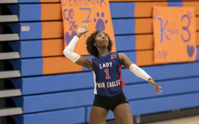 Putnam County senior Bernicia Harris gets set to serve in a recent match against Cedar Shoals in Athens on Sept. 25. SKYLA MORRIS/Staff