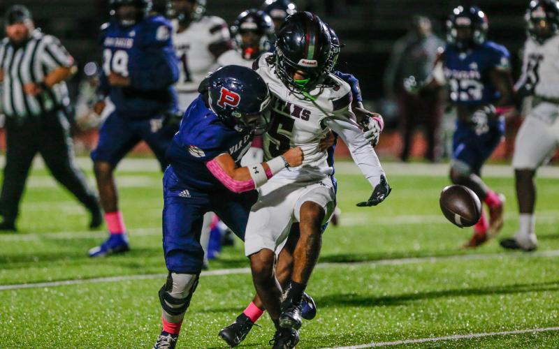 Griffin forces the ball out of a Titan ball carrier's hands and forces a fumble. LANCE MCCURLEY/Staff
