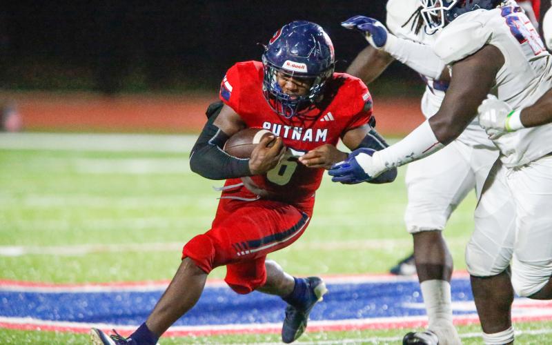 Putnam County running back Omarion Butts (6) rushes for a touchdown during the second quarter of last Friday's game against Lamar County. LANCE MCCURLEY/Staff