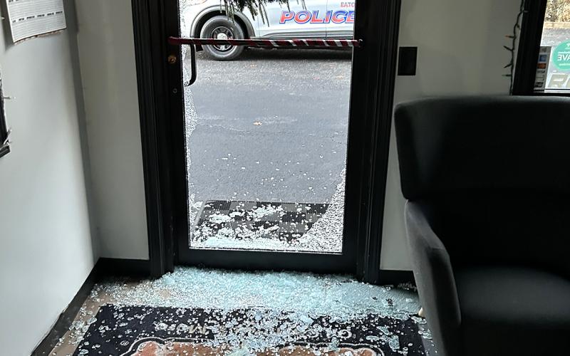 Shards of glass are scattered and piled around the back door of the Grease Monkey after burglars broke their way inside early Wednesday morning. CONTRIBUTED/EPD