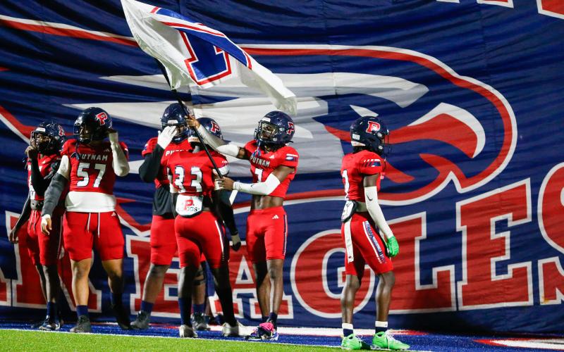 Putnam County football players get ready to lead the rest of the team out onto the field before the game against Lamar County on Oct. 17. LANCE McCURLEY/Staff