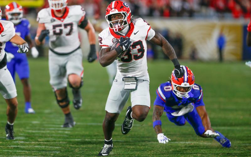 Georgia’s Chauncey Bowens (33) led the team in rushing last week with 70 yards on nine attempts and a touchdown against Florida. LANCE McCURLEY/Staff