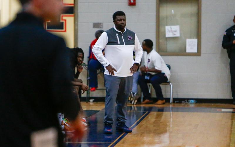 Putnam County head coach Patrick Marshall watches his team play on the court against Morgan County. LANCE McCURLEY/Staff