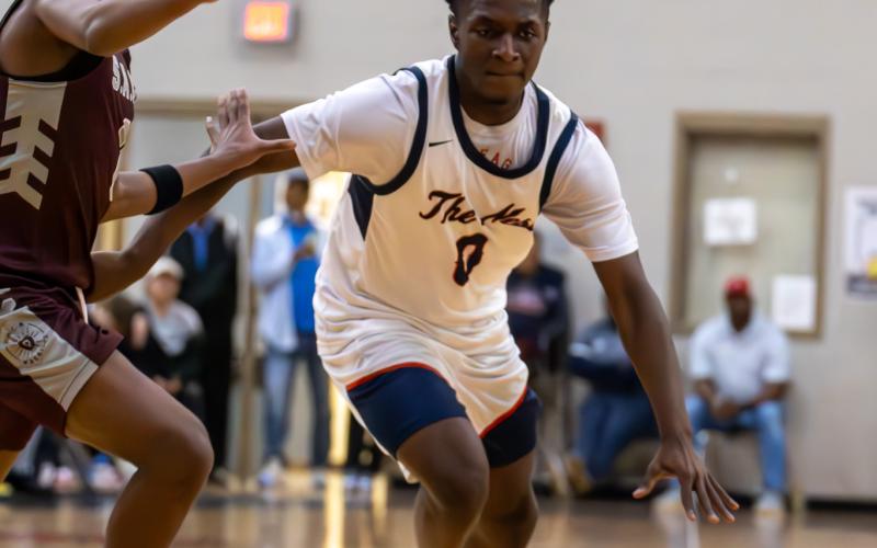 Putnam County senior Tamaud Woodson drives the floor in transition past a defender during a game against Southwest Atlanta Christian in the semifinal round of the Region 2-2A tournament on Feb. 19. SKYLA MORRIS/Staff