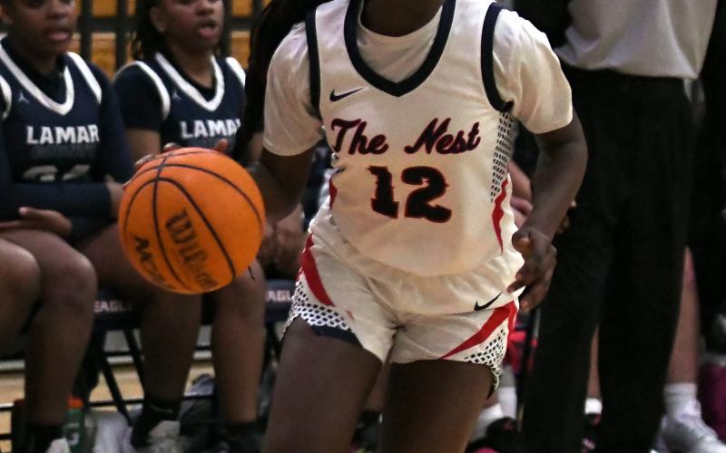 Putnam County junior shooting guard Eryiana Little tries to find a teammate to pass the ball to. IAN TOCHER/Staff