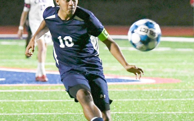 Putnam County senior midfielder Angel Sanchez (10) chases after a ball as he tries to score in a match against Jasper County on March 13. IAN TOCHER/Staff
