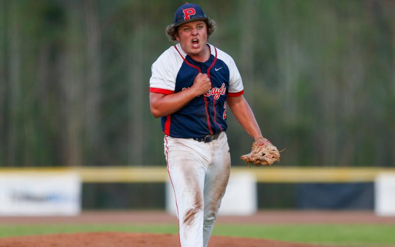 Putnam County senior Jackson Dodd pumps himself up on the mound after a big strikeout, helping the War Eagles maintain momentum game one against the Hurricanes. LANCE MCCURLEY/Staff