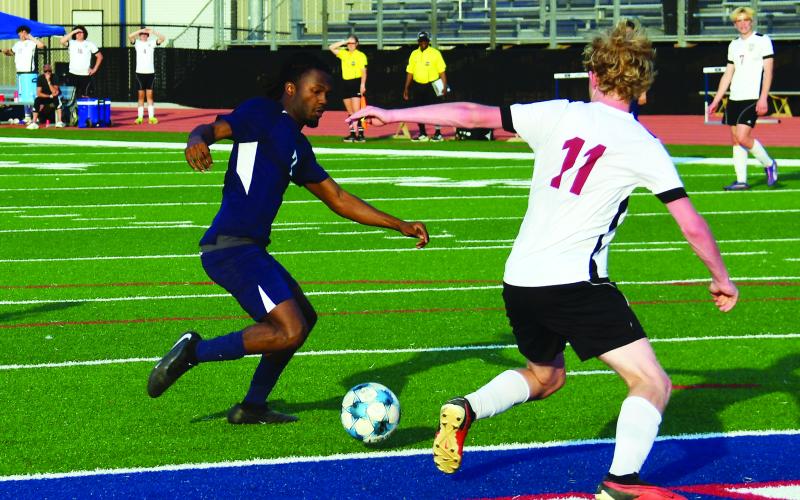Putnam County senior R.J. Hines (left) scored the War Eagles' lone goal in a 1-0 victory over Dade County on April 22. IAN TOCHER/Staff