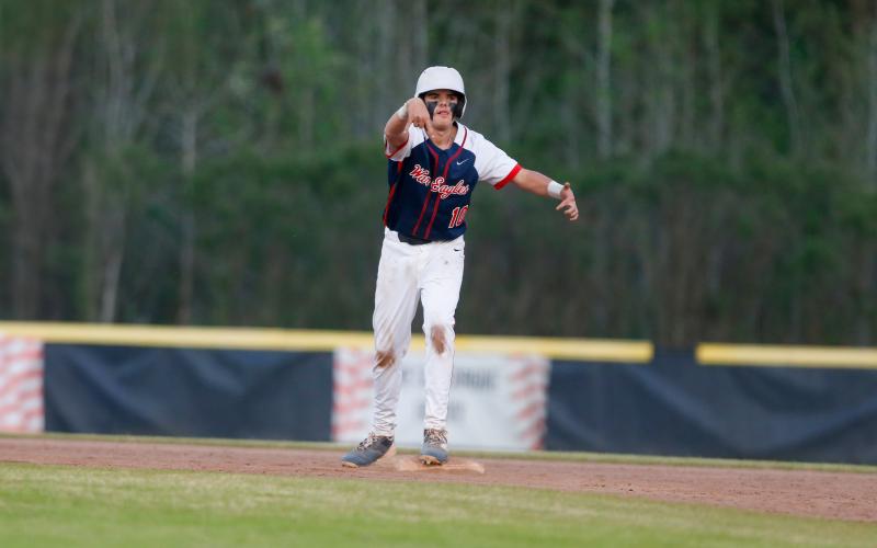 Putnam County's Parker Thomas celebrates reaching second base safely after hitting a double. LANCE MCCURLEY/Staff