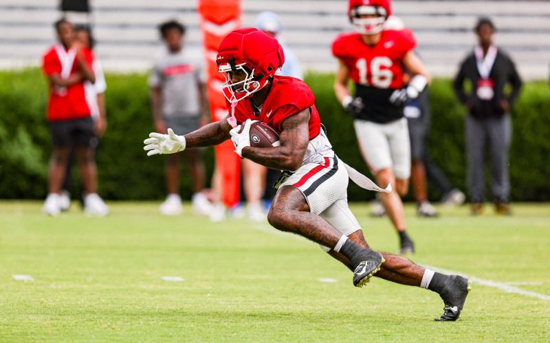 Georgia wide receiver Sacovie White-Helton cuts upfield, following his blocks in an effort to move the chains and pick up a first down. TONY WALSH/UGA Athletics