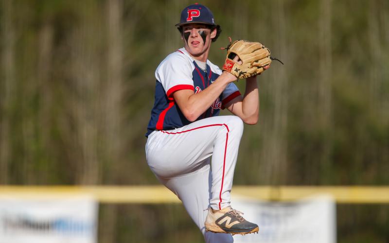 Ethan Whatley sets to deliver a pitch from the windup. LANCE MCCURLEY/Staff
