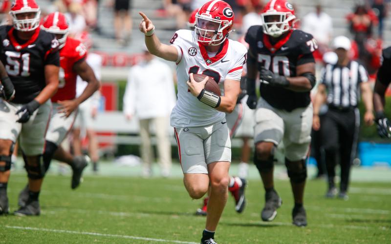 Georgia early enrollee Bryson Beaver (18) rushes for a first down during the G-Day scrimmage. LANCE McCURLEY/Staff