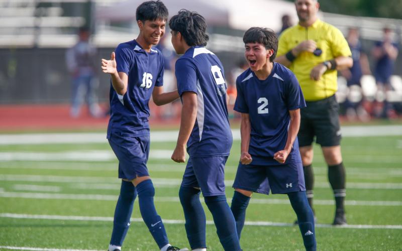 Putnam County's Reynaldo Espinoza (16) and Edwin Garcia (2) celebrate with teammate Jonathan Acostas (9) after he scored a goal last week against Vidalia. LANCE MCCURLEY/Staff