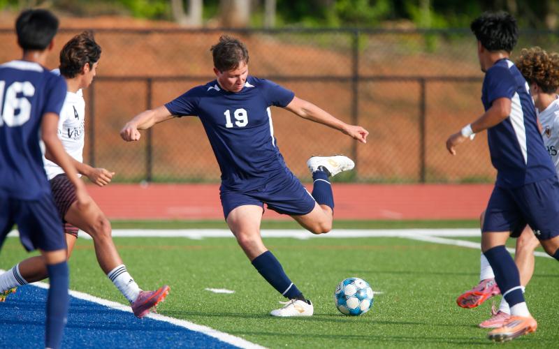 Alex Jimenez (19) prepares to send the ball into the back of the net for the War Eagles. LANCE MCCURLEY/Staff