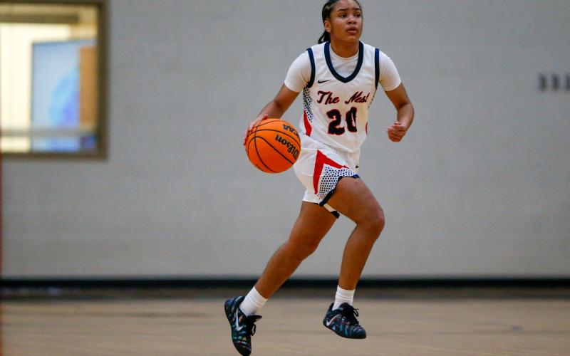 Jaydah Baker brings the ball up the floor in transition against Chattooga on Feb. 25. LANCE McCURLEY/Staff