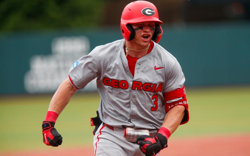 Georgia catcher Daniel Jackson rounds third base after blasting the go-ahead two-run home run in the top of the 10th inning against Mississippi State in Game 2 of the Athens Super Regional. (LANCE MCCURLEY/Staff)