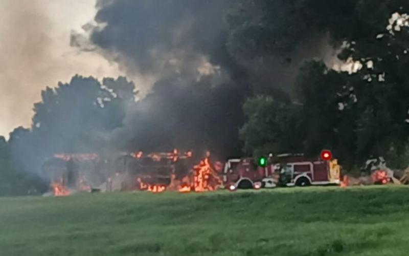 The barn and the farm equipment inside it are totally destroyed by the fire