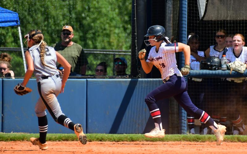 Kaitlyn Witcher charges toward home plate during Putnam County’s home doubleheader against Tallulah Falls on Aug. 22. IAN TOCHER/Staff