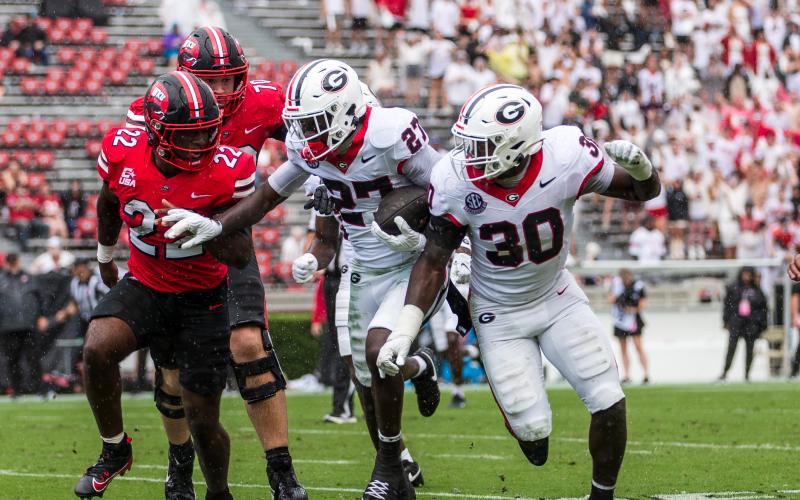 Georgia Safety Blake Stewart (27) intercepts a pass off the Hilltoppers late in the third quarter. SKYLA MORRIS/Staff