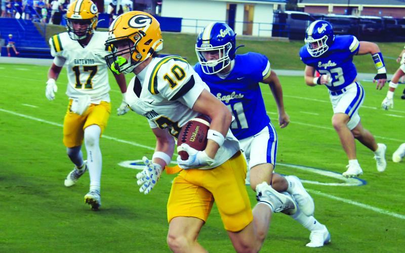 Gatewood quarterback Blake Brannen (10) rushes past Brentwood defenders in last Friday night's loss to the War Eagles. IAN TOCHER/Staff