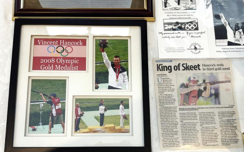 Pictures and newspaper clippings of Vincent Hancock’s accomplishments are on display.