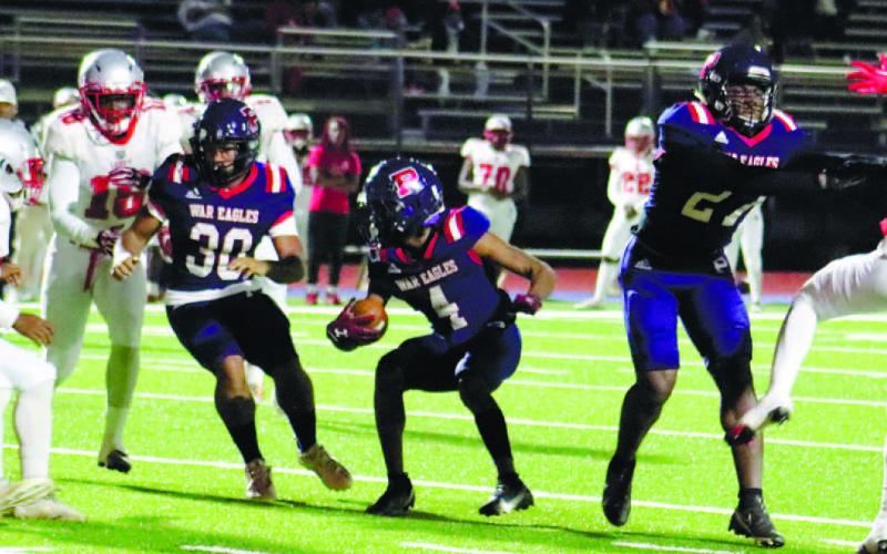 Putnam County wide receiver DJ Bland (4) eyes down a Laney defender while trying to gain yardage downfield in a win on Friday, Oct. 28. ARELLA CASH/Staff