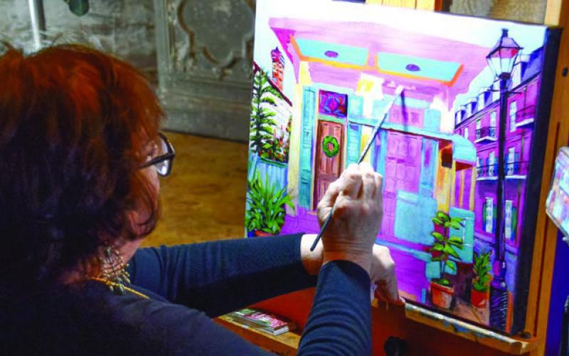 Local artists were on hand for ArtiGras, creating unique pieces while hundreds of revelers milled about beside them at The Livery. IAN TOCHER/Staff