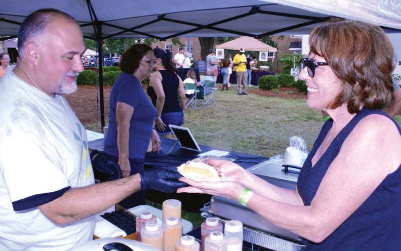 Smiles come easy at Taste of Eatonton, scheduled for Oct. 7 this year at The Plaza. CONTRIBUTED