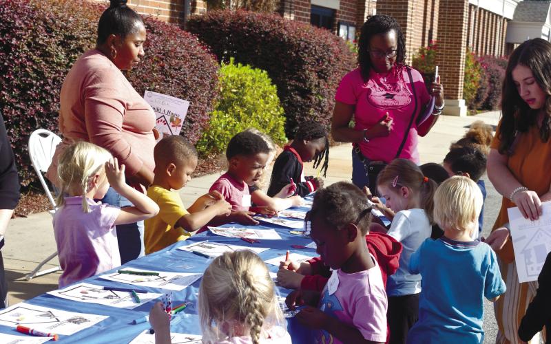 Mrs. Fortson and Mrs. Brown’s PreK class visited the County Board of Commissioners meeting Stephanie McMullen, Tina Fortson, Commission Chairman Bill Sharp, Chandra Brown, and Camryn Williams. Students enjoyed an art activity using markers, gems and stickers to create their own homes. CONTRIBUTED