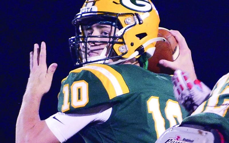 Gatewood quarterback Ames Johnson drops back to pass during a game last season. (File Photo)