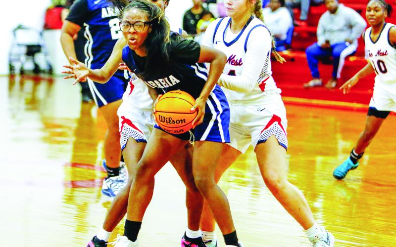 A pair of Putnam County defenders double-team an Arabia Mountain guard as she tries to advance the ball up the court. LANCE McCURLEY/Staff