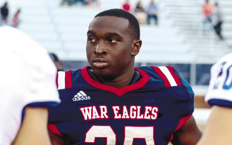 Former Putnam County running back Tamarion Peters represents the War Eagles as a team captain last season before the start of their home matchup against Oconee County, LANCE McCURLEY/Staff