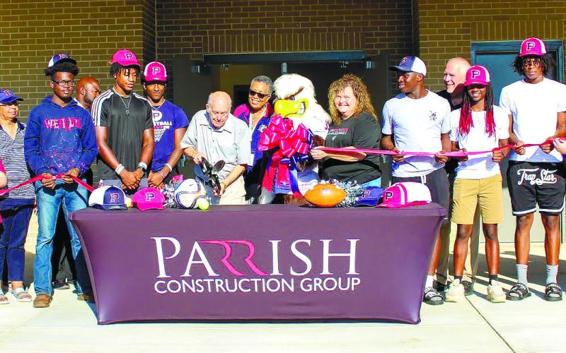 Board of Education members Eugene Smith and Carol Ann Gunthrie cut the ribbon. CONTRIBUTED