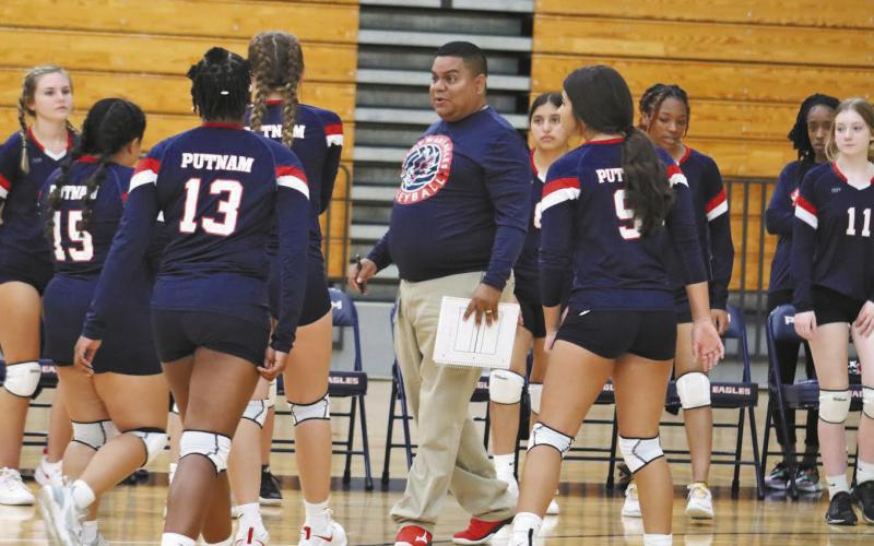 PCHS Varsity volleyball head coach Francisco Aguirre Arancibia attempts to rally his players during a tough opening-season match against their Jones County opponents.