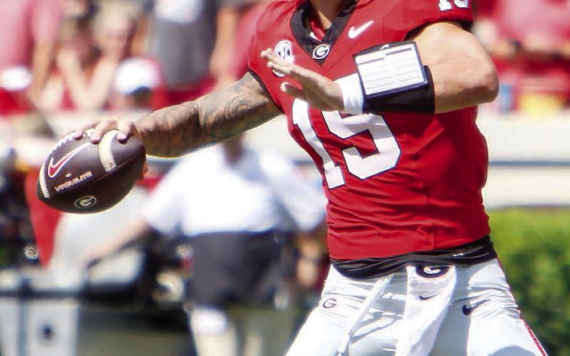 Georgia quarterback Carson Beck tied a program record by tossing five touchdowns against Tennessee Tech. (LANCE MCCURLEY/Staff)