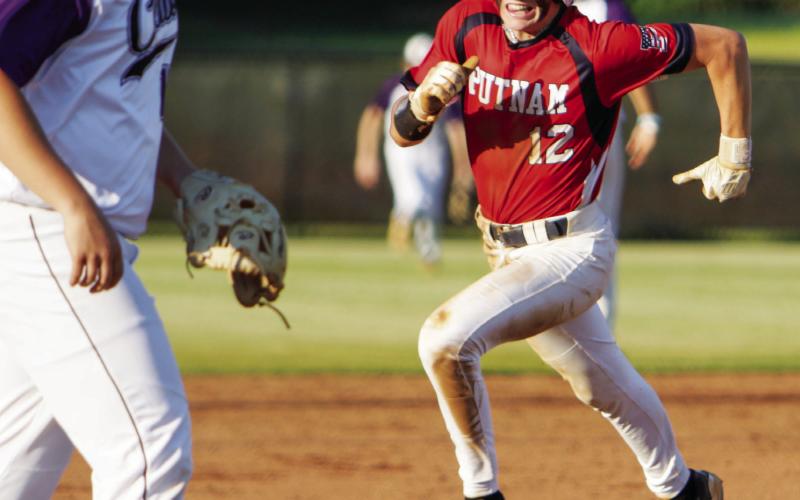 Ethan Whatley hustles around the base path trying to score a run. LANCE McCURLEY/Staff