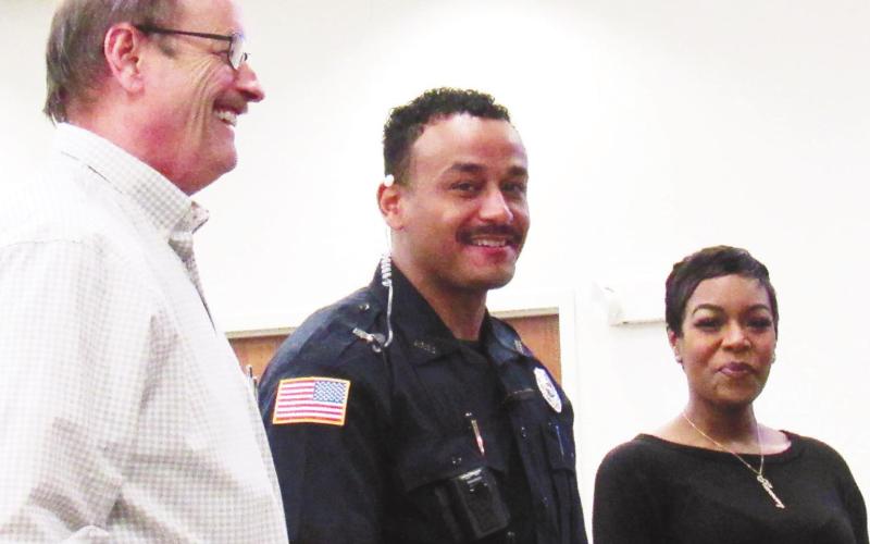 Eatonton Police Chief Howell Cardwell (left) introduces new City Police Officer Hargrove Jones and his wife to the city council at the regular April 5 council meeting. MARK ENGEL/Staff