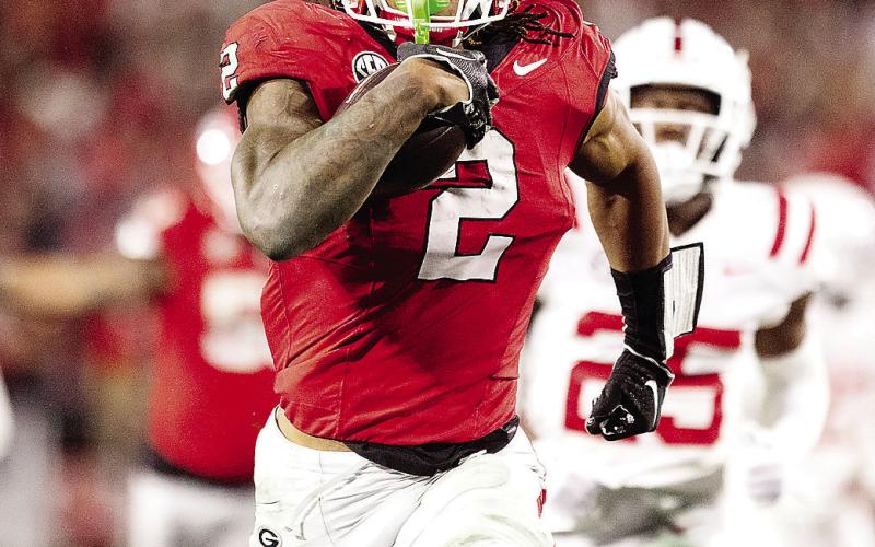 Senior running back Kendall Milton (2) had the breakout game of his career against Ole Miss in Athens, rushing for 127 yards and two touchdowns on nine carries. ZAK ROBINSON PHOTOGRAPHY/Contributed