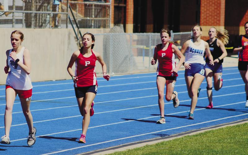 Alyssa Pennington and Jade Mullis in the 1,600-meter race. ARELLA CASH/Staff