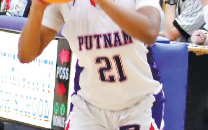 Kamyra Aikens (21) lines up for a 3-point shot. ARELLA CASH/Staff