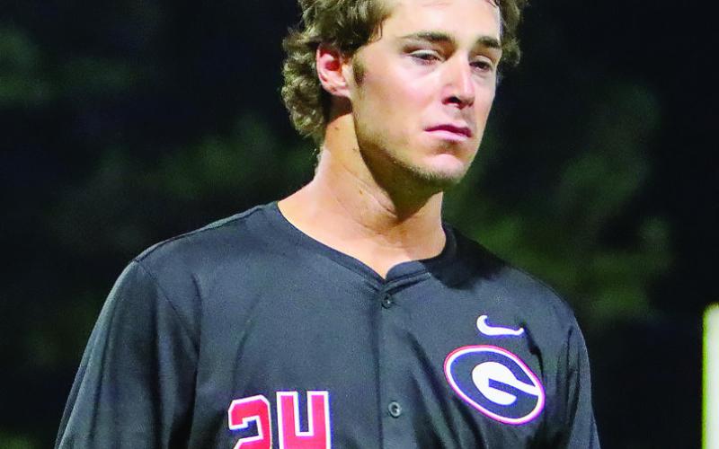 Georgia’s Charlie Condon, the nation’s leader in home runs, walks off the field showing emotion after Monday’s loss. LANCE McCURLEY/Staff