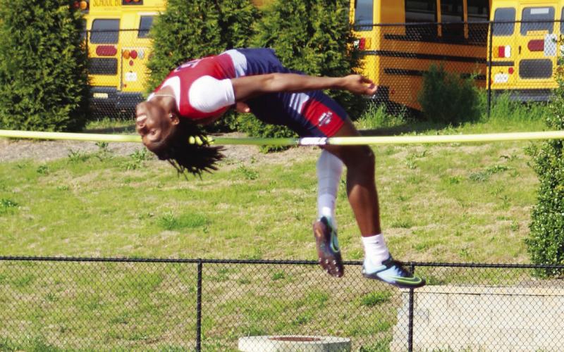 Putnam County senior Bill Waters clears 6-feet, 6-inches on the high jump event at a home meet earlier this season. KIM CASH/Contributed