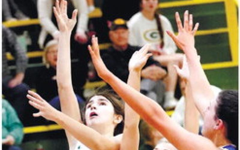 Eighth-grader Lauren Paxson (1) shoots a layup over two Brentwood defenders. DR. BOB BETZEL/Contributed