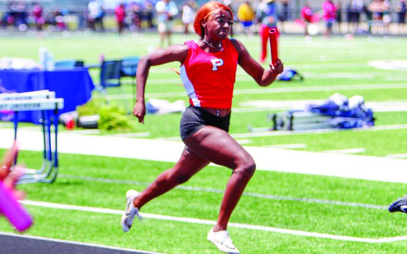 Putnam County’s Baylen Yarbrough runs a leg of the 4x200-meter relay race. LANCE McCURLEY/Staff