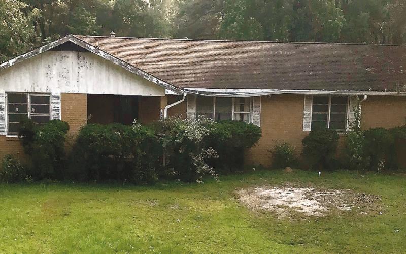 The scenery around this house on the corner of Pennington Road and Peachtree Avenue in Milledgeville seems peaceful after multiple law enforcement agencies conducted a raid on it early Tuesday morning. CONTRIBUTED