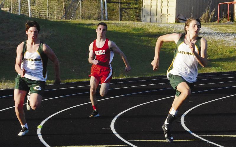 Freshmen runners Colt Jenkins (left) and Bodie Corry round the final turn in the 400-meter sprint for Gatewood. TREY NORRIS/Staff