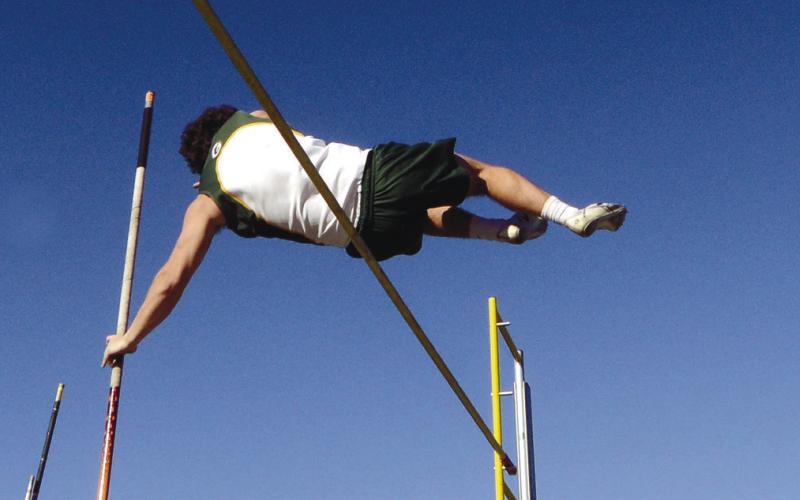Gators pole vaulter Dakota Davis clears the 8-foot-6 bar to win last week’s meet at Gatewood. IAN TOCHER/Staff